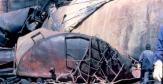 Citernes et cuves incendiées et effondrées après accident