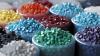 Photo montrant une dizaine de petits pot en verre contenant des billes de plastique de différentes couleurs